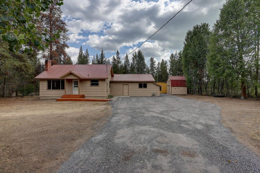 Completely Updated Custom Home on 3 Acres Bordering BLM Land! The private location gives this property LOTS of possibilities; 1862sf, 5Bd/2Ba, with New Upgrades include: Metal Roof, Vinyl Windows, Septic, Well & Pressure Tank, Interior & ExteriorPaint, Slab Quartz Counters, Solid Wood Cabs, Wood-Lam & Tile Floors, Carpets, HW Heater, Bathroom Fixtures, Insulation and MORE! 1200+ Detached Frame Shop, large frame storage building, fenced w/security gate and separate access to the additional acreage bordering BLM allowing for additional Shop(s) and possible commercial business setup w/City-County CUP!