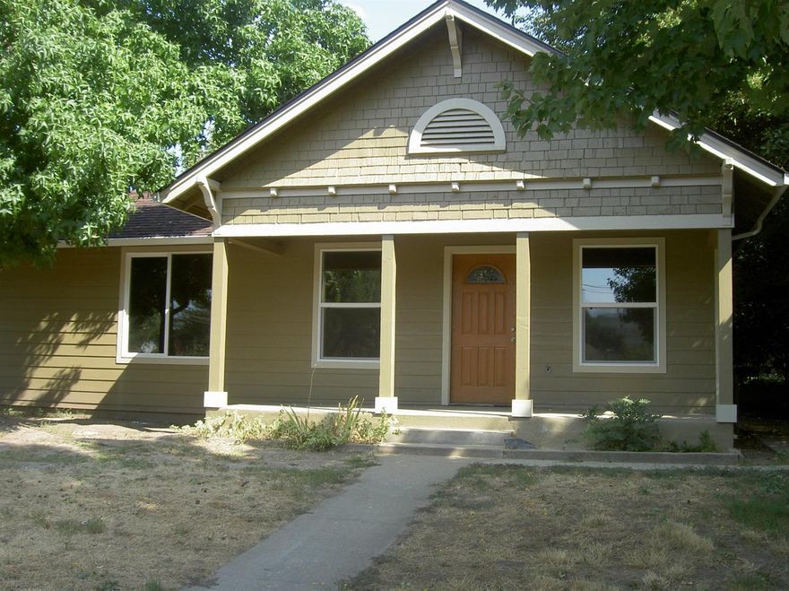 Craftsman style home has just been updated with all new wiring, plumbing, heating, air conditioner, roof, laminate and tile flooring, vinyl windows, paint inside and out, range/oven, dishwasher, gar. disposal, etc. Extra large R-3-1 lot with the possibility of extra units. Located close to schools, shopping, hospital, doctors, walk-in clinic, etc. Move in ready. Listing agent is related to sellers.