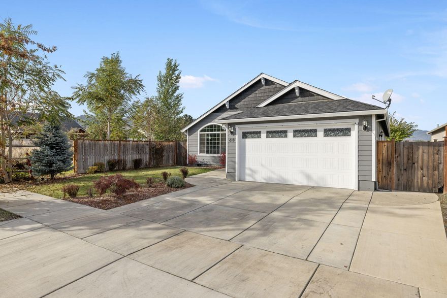 This delightful 3 bed, 2 bath home is located Southwest Medford. Once inside, you'll be greeted by the elegance of vaulted ceilings that create a spacious and inviting atmosphere. The modern kitchen features stunning Quartz countertops, perfect for preparing delicious meals and hosting family and friends. This home has an abundance of storage space with walk-in closets, storage shed in the backyard and a convenient 2-car garage, making your life more organized and efficient. Outside, you'll find easy maintenance landscaping with timed sprinklers. But that's not all - this property offers a unique advantage: it's bordered by a field on two sides, with no back or side neighbors, providing the ultimate privacy and tranquility. To top it off, the primary bedroom includes a beautifully appointed private bathroom, offering a personal sanctuary for relaxation, tiled shower and jetted tub. TONS of upgrades in this home.