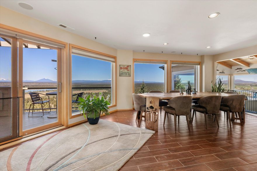 Stunning hilltop estate with 360-degree unobstructed views on top of Cinder Butte! See the Oregon Cascade Range, Buttes, Craters and Smith Rock all from this 3.53-acre property. Enjoy beautiful sunrises and sunsets across green fields, canyons, ponds and vistas in this grand 5,239 sf contemporary home boasting 5 bedrooms and 4 1/2 baths, a loft office and bonus rooms on three levels. The spacious upper-level owner's suite has built-in wardrobes and cabinets and a fireplace, luxurious bath and a bed that rotates 360 degrees. The scenery from every room including the hallway is breathtaking! This must-see property features main floor living, plus a second lower-level entrance to a 3rd ensuite, two bedrooms, kitchenette/laundry, bathroom and family room. New carpeting on every level. Walk from a fenced yard to the flagstone patio for stargazing by the fire after sunset. Make the best memories on the West deck where glass panels maximize Mountain views.