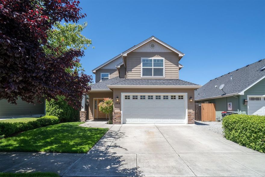 Here's your great opportunity to own a beautiful family home in a desirable location of Medford. Enjoy this comfortable 4 bed. 2 1/2 bath home, with a nice fenced yard and mature landscaping. The lovely great room boasts a beautiful rock fireplace that opens to the roomy kitchen and dining room. The kitchen is nicely appointed with plenty of beautiful cabinetry, stainless appliances and plus refrigerator and 2 large pantries. Relish in the large master suite, tucked away for privacy. The master bath has a large soaker tub, ample vanity with double sinks, a private water closet, and a good sized walk-in closet. There is plenty of storage throughout the home and a nice fenced backyard with automatic sprinklers front & back. Seller will provide buyer with a home warranty. Freshly painted inside with all new carpeting!