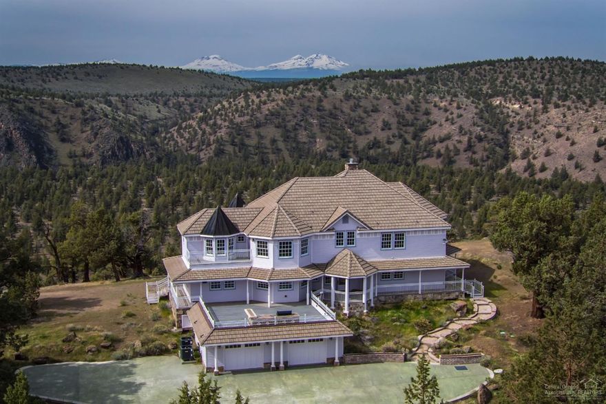 Looking for Breathtaking Views, Quality, Privacy, Fly Fishing, Hiking and Relaxing? This is the place for you! Attention to detail with high end custom finishes throughout. Marble, natural stone, wood, Trex decking, stamped concrete, complete outdoor kitchen, freestanding custom curved staircases in the main greatroom and the master bedroom. Sweeping views from every nook and crany! Huge Cascade Mt. views (Sisters-Hood), Smith Rock. Perched above Steelhead Falls and backs to BLM.