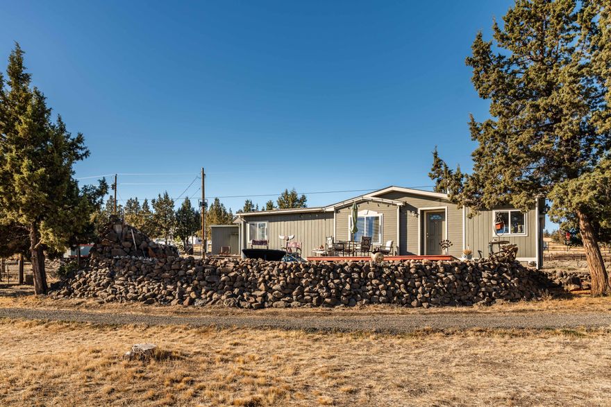 The peaceful slice of Prineville that you've been waiting for. Well maintained home, detached garage/workshop, and covered shed area sit atop a manicured, low maintenance piece of land with vast views! Three gated entrances to the large, newly graveled driveway. Property is fenced and cross fenced with 3 sections. Stay cozy in the Winter with pellet stove in the home and wood burning in shop. Fenced garden area! The home has a wonderful floorplan, nice sized bedrooms, laundry room and 2 full bathrooms. Front deck looks over the entire property and view, firepit and water feature included! A fully enclosed mud room at the entrance of the home! Minutes to BLM and many outdoor activities! Must come see in person to really appreciate all of it's glory and the wildlife!