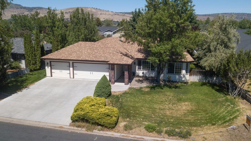 Sunset Village rancher with secluded backyard. Single level living with open floorplan, spacious main bedroom. 3 car garage. Ample storage. Good natural light. 2 peach & 2 apple trees. In ground sprinklers, waterproof vinyl flooring. A Beautiful Home!