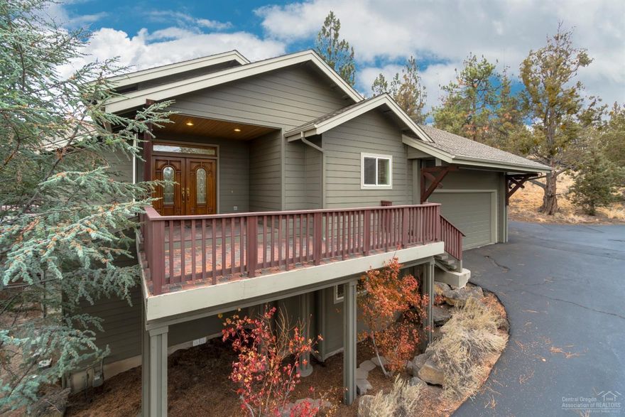 Beautiful Awbrey Butte home nestled on private 1.15 acres surround by natural rock outcroppings, mature trees and easy care landscaping. Main level master with jetted tub, dual sink vanity plus walk-in closet and sliding glass door to deck boasting beautiful city views. Kitchen features granite tile counters, island with eating bar and lots of storage. Formal dining plus cozy breakfast nook with access to back patio. Large bonus room downstairs with separate entrance plus 2 bedrooms and full bath. Grand triple car garage, 2 water heaters and gas furnace with AC. This home awaits your personal touches!