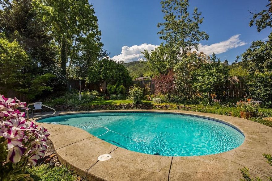 Light and airy 3 bedroom home located on a quiet cul-de-sac in Meadowood subdivision. Home backs to the railroad tracks and unobstructed mountain and vineyard views. Backyard is an oasis with 8 foot in-ground pool and mature landscaping. Plum trees, Japanese maple and over 20 varietals of flowers. Main level master suite with slider to the backyard. Living room has soaring vaulted ceilings with oversized clerestory windows. Upper level features two more bedrooms and full bath. Two car attached garage. Close proximity to downtown Talent, wineries, freeway access and Ashland.