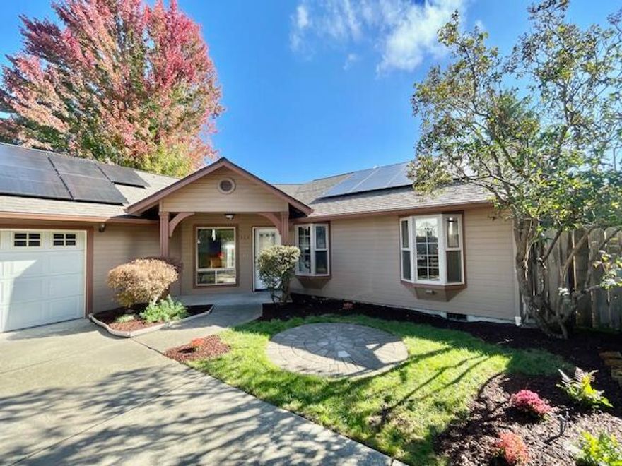 Welcome to 260 Arnos Street — a peaceful retreat tucked away in one of Talent's most convenient locations close to downtown Talent and just minutes from Ashland! This beautiful 3-bed, 2-bath home offers style and efficiency. Bright, vaulted ceilings and an open layout center around a cozy gas fireplace. The kitchen features quartz countertops, new sink, faucet, and disposal. The primary suite includes private patio access, perfect for relaxing. Enjoy a peaceful backyard with mature landscaping and garden beds. Fully paid-off solar panels keep energy costs low and come with a 20+ year warranty—comfort and savings in one move-in-ready home!