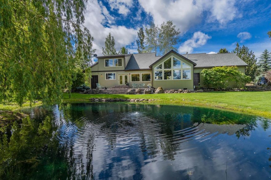 Tumalo Paradise with gorgeous mountain views!  This unique and exceptional Equestrian Property offers a picturesque setting like no other— 5 lush acres, a variety of mature trees, a tranquil pond, ambient gardens and breathtaking views of Mount Jefferson. The exquisite, light filled home is perfectly positioned to capture the expansive and picturesque landscape from every window.  Partially remodeled by J.  Nordquist in 2015, the architecture has a ''modern mountain'' aesthetic with soaring ceilings and impressive accents including Douglas fir flooring, wood beams, stacked stone fireplace, custom cabinetry. Master on the main has an attached south facing sun room, luxury bath. Bonus/family room downstairs with attached sun room.  3 bedrooms upstairs share a remodeled guest bath.  Back staircase has a separate entrance for multi generational living.  2 beautiful outdoor living spaces.  Two stall barn, greenhouse, 2 sheds. Close to Tumalo Reservoir for miles and hiking, biking and riding