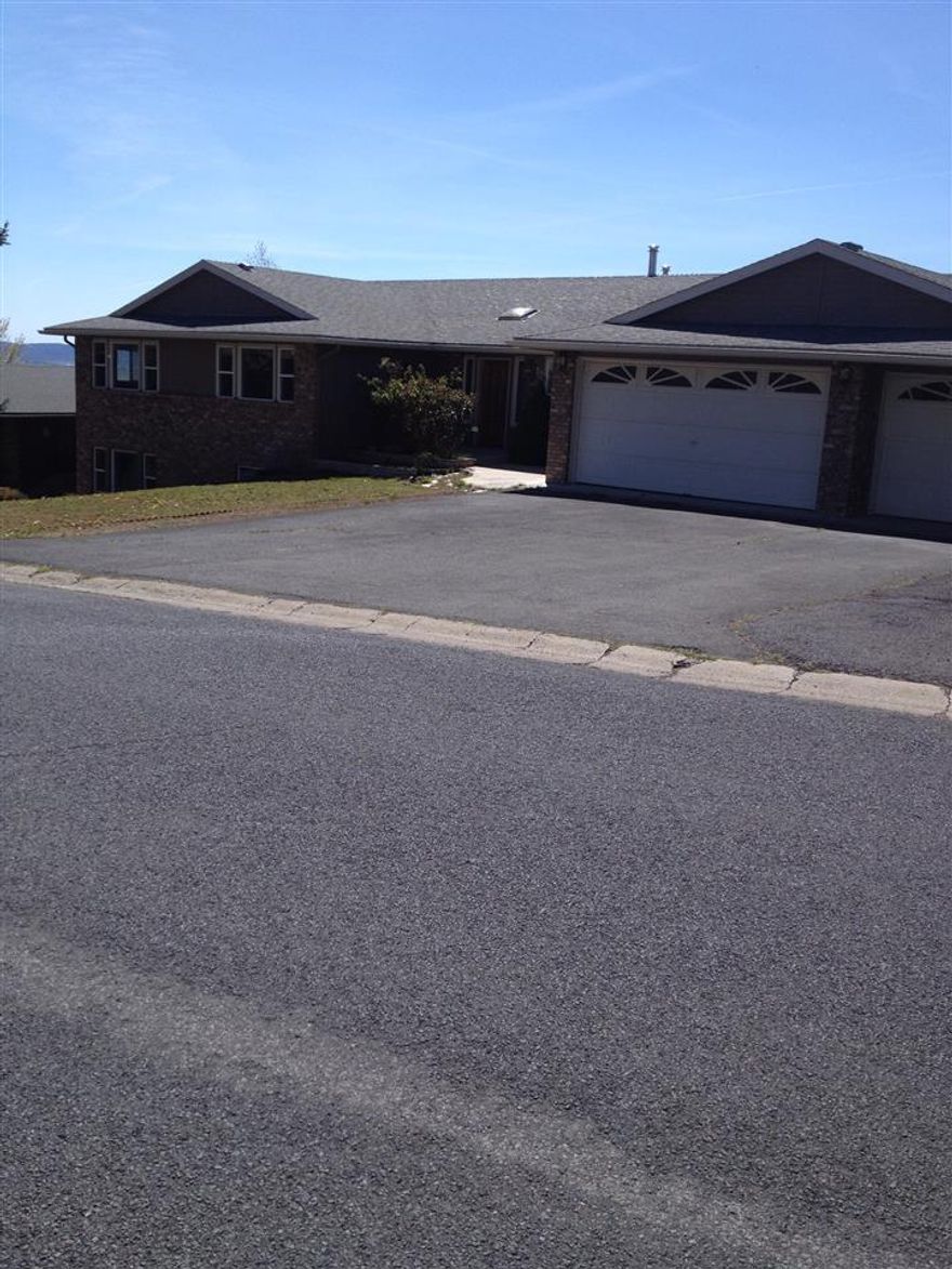 Moyina Heights Home With Views Of The Mountains And Valley. Beautiful Home With Large Rooms, Open Kitchen, Lots Of Cabinets, Fireplace, Basement Has Two Bedrooms And Bathroom With A Couple Of Unfinished Rooms.