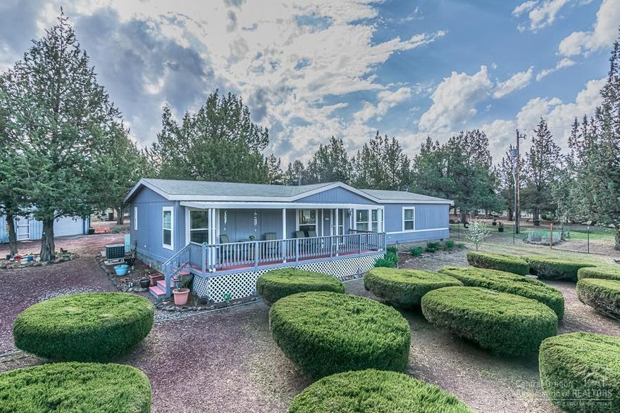 Well kept 4 BR, 2 BA, 1728 sq ft home on 1+ ac w/Cascade Mountain views. 6 ft chain link fencing, paved roads, large covered front porch & low maintenance landscaping. Spacious kitchen w/nook, separate living & family rooms, bedrooms have built in dressers, large master suite & central air(heat pump). 1800 sq ft insulated/sheet rocked shop w/220V. Shop has kitchen area + wood stove, many possibilities. Use the gate off Shad Road to enter the property,