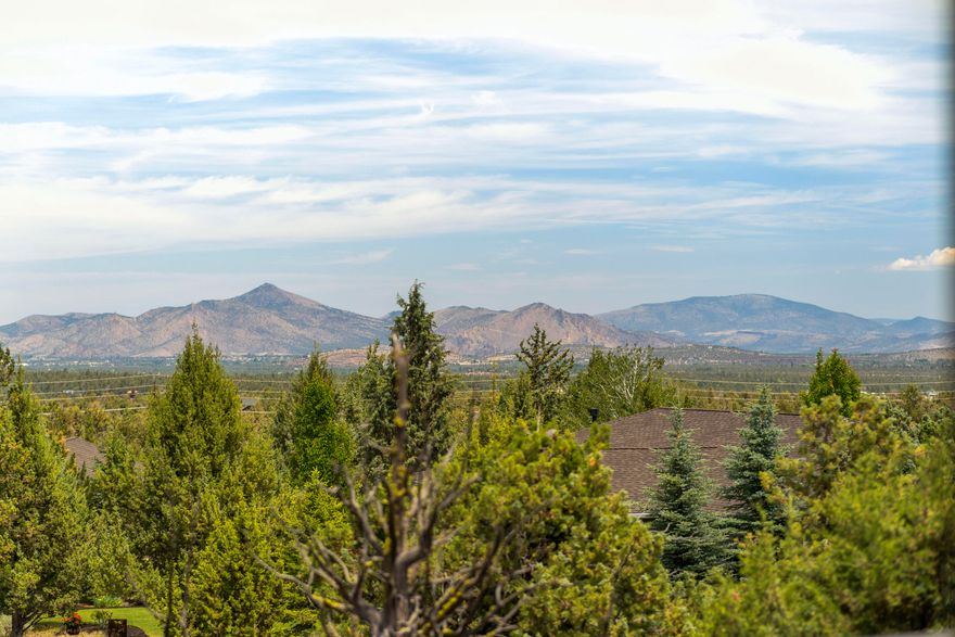 Priced To Sell! Beautiful Single Level Home With Breathtaking Smith Rock Views Backs To Common Area in Eagle Crest Resort! This exceptional one owner home offers an open concept floor plan blending natural beauty with a cozy atmosphere. The great room boasts Bamboo hardwood floors throughout with a stone gas fireplace. The kitchen is a chef's delight with granite counters, stainless appliances, a gas range and breakfast bar. The primary suite has patio access and includes dual vanities, soaking tub, separate walk-in shower, private water closet and walk-in closet. There are also two guest bedrooms with Jack and Jill bathroom perfect for family or guests. Additionally, there's a dedicated office or potential 4th bedroom. The paver patio with hot tub and fire pit along with multiple outdoor spaces create the perfect setting to relax and enjoy the views or entertain with ease. Enjoy all Eagle Crest amenities and Deschutes River access with world class fly fishing!