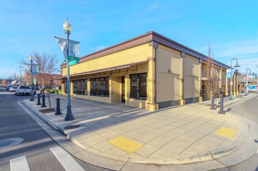 Amazing 2 story building in highly visible prime downtown Medford location. Completely reconstructed in 2000 with high end finish materials. Ground level features 5425sqft of professional office space, plus an additional 2100sqft of potential retail space that was remodeled in 2012. Potential Retail space has large windows and exceptional street exposure in high traffic area. Second level has 5185sqft of additional finished space that could be used as conference rooms, office space, etc. Hydraulic elevator that runs on vegetable oil allows easy access between levels. There are 4 ADA compliant bathrooms with upgraded finishes. Building has 2 marquee spaces available & 3 convenient entrances on the ground level. Building is extensively wired for computer networking, has 3 Phase power, security alarm system & commercial carpet throughout. Building is currently fully leased, ask agent for details. This is a wonderful opportunity to own a high quality building right in the hub of downtown!