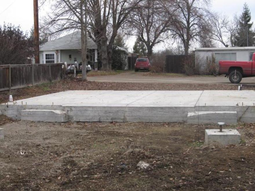 Great opportunity for large lot in West Medford. Garage/Pad poured. Ready To Build! Some improvement to lot. Plenty of room for other outbuildings. Private setting on level ground. Buyer to perform due diligence with Jackson County.