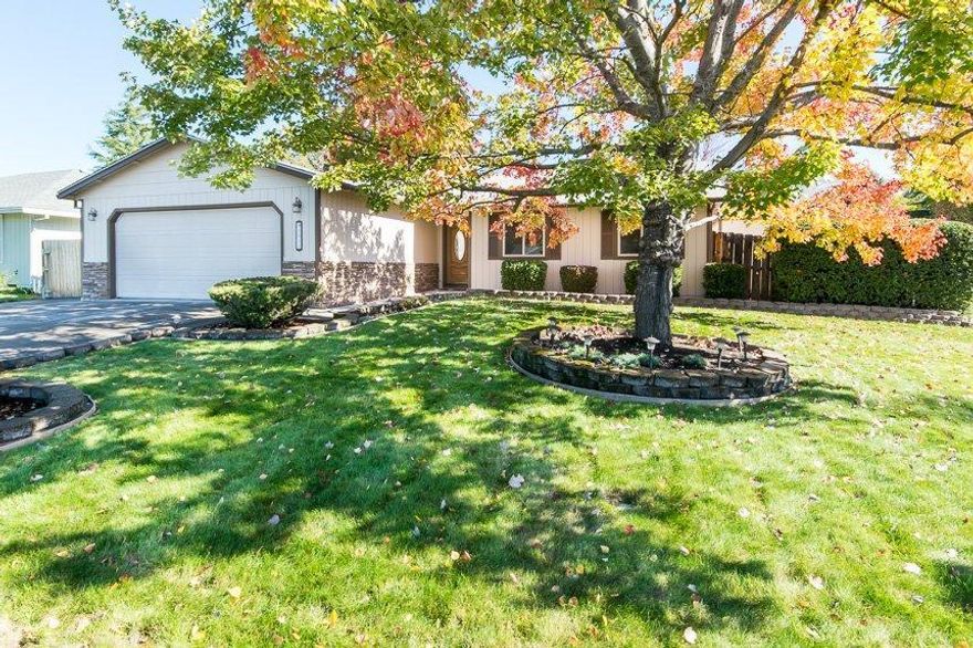 Another East Medford surprise with RV parking! Nice corner lot that sits on .20 of an acre with three bedrooms, two full baths, and an amazing backyard. This home features a koi pond, maple trees, nice deck, raised garden beds, small detached shop area with a little cabin and Corian Countertops in kitchen. Cozy up to the certified wood burning fireplace with wood already chopped and stacked up for you in the backyard. Sellers just installed new carpet and painted some of the interior. The curb appeal on this home will show the pride in ownership before you ever step foot in the home. The main picture was taken just a month ago to sow you how beautiful the front yard is when the leaves are still hanging on this November.