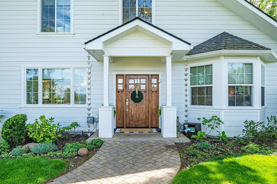 Beautiful Farm Style Home on 4.1 acres (3.31 irrigated). Country Living	but closeto everything! 2,311 sq feet, 3 bed w/ office, or 4th bedroom, 2.5 bath w/bright open floor plan. Main level primary suite features generous walk-in closet & beautiful bathroom. Open kitchen features granite countertops, large dining island & pantry. Hardwood floors flow into open Living & Dining spaces w/large windows that allow picturesque views of surrounding property. Property includes Large Barn, Storage Shed, 816 sq ft Detached Insulated Garage w/built in gym, cabinets, EV charger, epoxy floor, upstairs finished office/craft-room/art studio. Enjoy deck w/lights, covered picnic area & historic outdoor fireplace, seasonal pond, fruit trees, garden. Must tour to fully appreciate all that it has to offer.