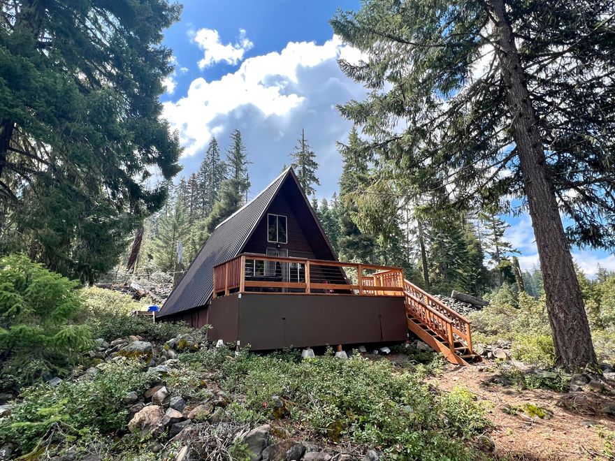 Bliss! Imagine being able to drive 45 minutes from Medford to then hop on your boat & after a short ride, pull up to your own private boat dock to enjoy your vacation cabin on Fish Lake! The Oregon dream is for sale! Hidden amongst towering fir trees on the South side of Fish Lake, is this modest A-frame cabin is accessible by boat and has its own private dock. This cabin has a loft bedroom, a kitchen, living & dining area. All is open w/beautiful pine walls, bamboo flooring, & a hatch ladder that pulls down to access the loft. This cabin comes furnished. The cabin has a roomy deck in the back & a deck out of the front to relax & appreciate the Lake views, wildlife, & spectacular natural surroundings. A short boat ride will get you to Fish Lake Resort, & roughly 8 miles from Lake of the Woods. The land is leased from the Forest Service at a cost of $2622.00 yearly. The property taxes for 2024 are $266.34 Must be accompanied by Broker to tour.