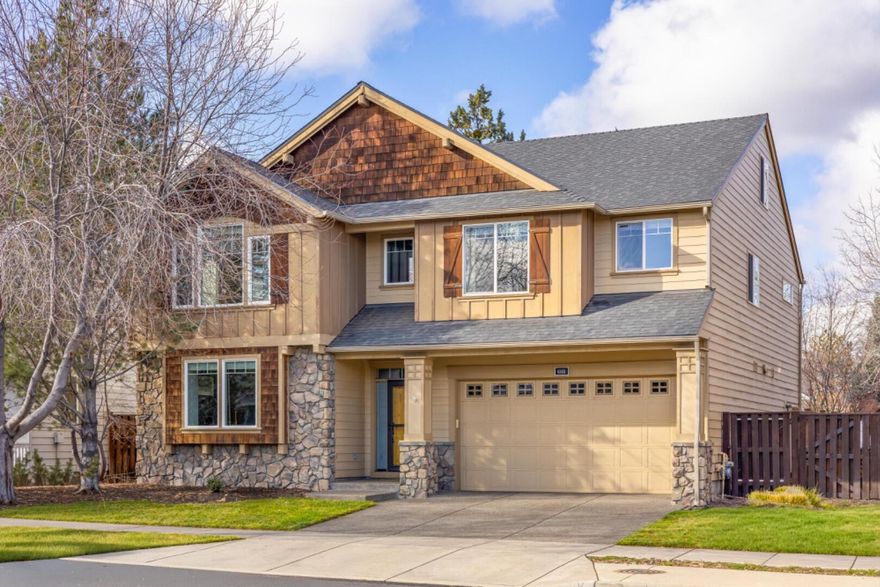 Gorgeous Northwest design with canal frontage in the desirable Lava Ridges community of NE Bend. Thoughtfully built by Pahlisch Home Builders, this stunning 3514 sqft, 5 bedroom home offers an open great room floor plan highlighted by stone accents, gas fireplace, and custom built-ins. The spacious kitchen is beautifully appointed with stainless steel appliances, hardwood floors, a butler's pantry, and both formal and informal dining areas. The primary suite serves as a relaxing retreat with a private bath featuring a double vanity, oversized soaking tub, and generous walk-in closet. Additional highlights include a large second story bonus room, an expansive third story loft with a fifth bedroom, and a secluded hobby room off the garage. Enjoy exceptional outdoor living with professionally landscaped grounds ideal for entertaining. Conveniently located near the seasonal community pool and close to schools, parks, shopping, and dining. Schedule a private showing with your broker today.