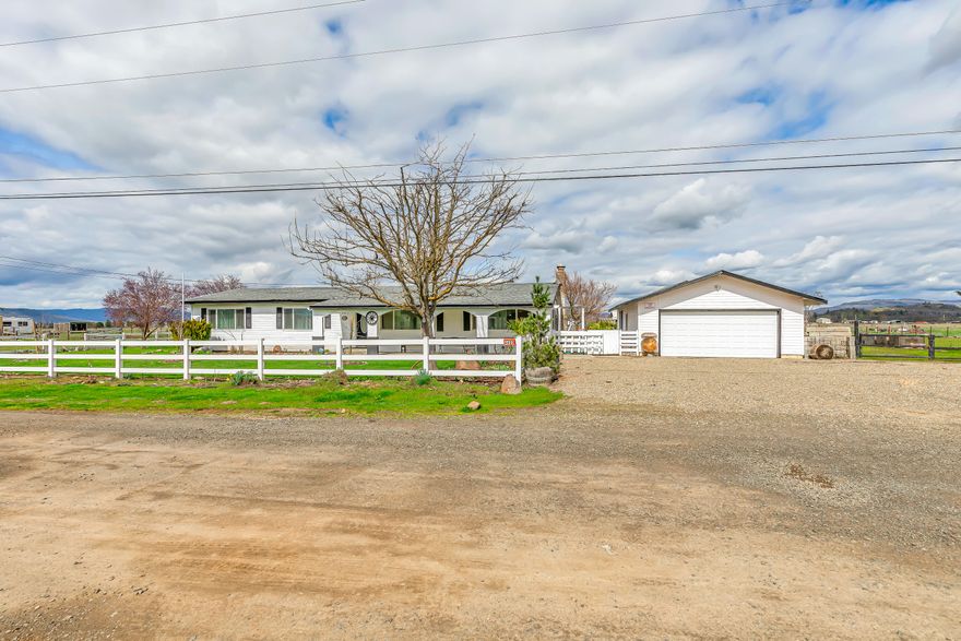 Move-in ready ranch-style home on over 9 acres! This beautiful 3-bed, 2-bath property offers the perfect blend of comfort and country living. The open floor plan features Carrara tile countertops, stainless steel appliances, and an inviting atmosphere, perfect for entertaining or family gatherings. Appliances are included, making it truly move-in ready. Outside, the flat, usable land is ideal for a growing family looking to live off the land. A barn, shed, and plenty of space for animals, farming, or recreation make this property a dream. The backyard is set up for entertainment and fun, offering the perfect place to relax and enjoy the outdoors. Enjoy the peace and privacy of rural living while staying close to modern conveniences. Whether you dream of raising animals, gardening, or simply enjoying wide-open spaces, this property is a rare find. Don't miss this incredible opportunity to own a fully equipped home with endless possibilities!