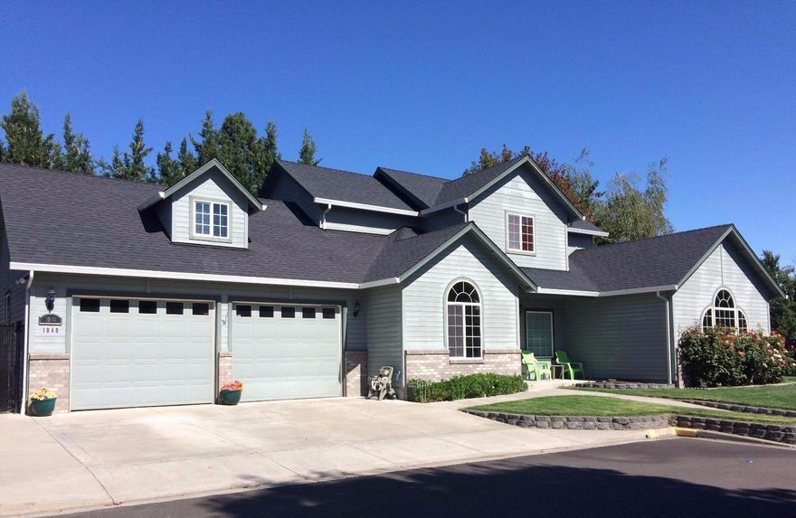 Contemporary 2 story 2511 SF home built in 2004. Main level oversized master has a coffered ceiling, large walk-in closet and French doors to the back patio. Master bath is also spacious with a double walk-in shower, double vanity and tile floor. Kitchen features laminate wood flooring, granite counters, oak cabinets and walk-in pantry. Great room has 12 foot vaulted ceiling and a cozy gas fireplace. Entertainment room/den provides for two separate living spaces and opens to the backyard. Main level also features an office, laundry room and half bath. The upper level has 2 bedrooms, both with walk-in closets and an oversized full bath. Fully fenced backyard with covered patio area and garden shed. 2 car attached finished garage with built-in work bench, sink and 200 SF of storage space in attic. RV parking and in-ground sprinkler system throughout. Quietly located at the end of a cozy street of newer homes with the largest lot.