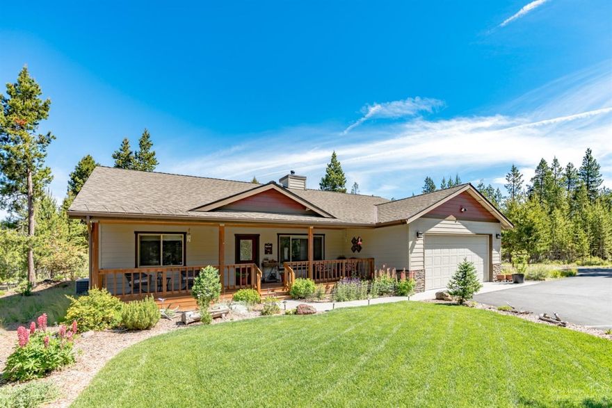 Beautifully appointed home with open & vaulted great room style living, spacious kitchen with island, hickory cabinets, knotty alder finishes, stainless appliances, instant hot, laminate flooring, wood stove, forced air electric with heat pump, covered front and back porches with pine ceilings, hot tub, over sized two car garage, 884 sq ft shop. Immaculate 2 acre property sits at the end of a paved road. Paved circular drive, completely fenced & gated, Horse shoe pits, Landscaped & Irrigated. Must see