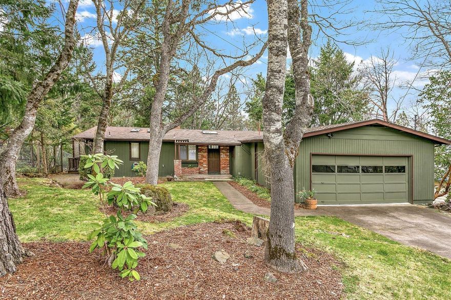 Main level living home on serene setting overlooking Roca Canyon. Above the University and 5 minutes to downtown. New light carpeting and light wood floors enhance the light feel of this home. Main level master with tired master bath. Adjoining office/den. Living room with vaulted ceiling and fireplace. The kitchen has a large granite island with bar seating. Lower level has spacious open Great room, wine cooler, bedroom, dark room, full bath and tons of storage. Relax in the treed setting, spacious decking and hot tub overlooking Roca Canyon.