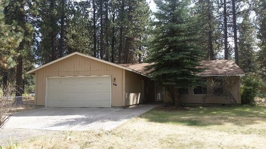 Large treed lot with ample sunshine and a private setting in Deschutes River Woods. Located on a quiet, paved road in a nice area of DRW. Home features 3 bedrooms plus an office/den, 2 bathrooms, living room & spacious family room. Plenty of parking with a 2 car garage & an RV area.