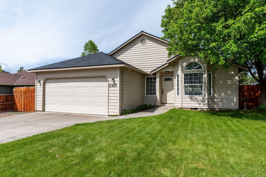 *Short Term Rental Eligible* Flooded with natural light, this beautifully maintained 3 bed/2 bath home combines comfort and style in a fantastic location. The renovated kitchen now features an open-concept layout to the living room, highlighted by a custom blue pine island. The primary bathroom has been stylishly updated, and the roof was replaced in 2022 for added peace of mind. Step outside to a gorgeous deck overlooking a fully fenced, manicured yard with mature trees—ideal for relaxing or hosting gatherings. Just minutes from schools, the hospital, Al Moody Park, and dining such On Tap food carts and Sunriver Brewery, this move-in-ready home offers the perfect blend of convenience and charm.
