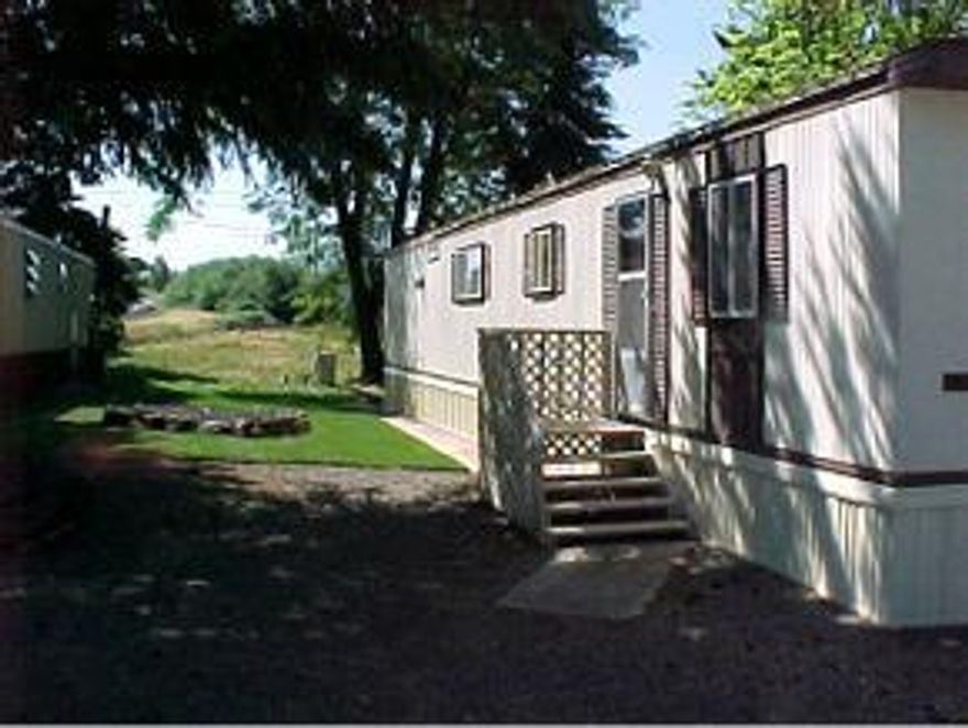 Clean as a whistle comfortable, convenient manufactured home in Ashland Acres Estates. Family park in country setting. Owner financing available to qualified buyers. Space rent $245 a month. One of sellers has inactive real estate licence in California