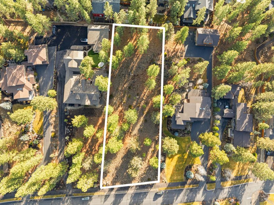 One of the last chances to build in Parks at Broken Top—only five homesites remain in this highly desirable NW Bend community. This 0.82-acre, gently sloping, treed lot offers an exceptional setting for a custom home surrounded by natural beauty. Enjoy an active Central Oregon lifestyle with paved walking paths, access to nearby mountain biking and running trails, neighborhood parks, and the Parks Community Pool. Conveniently close to Westside shops and restaurants, and just minutes from Mt. Bachelor and the Cascade Lakes, this premier homesite blends privacy, recreation, and everyday convenience. A rare opportunity to create your dream home in one of Bend's most sought-after neighborhoods.