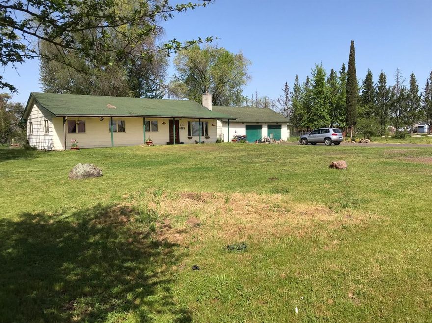 Absolutely amazing opportunity! Close in level, acreage with irrigation. Ranch style home with front and back covered patios. Detached, oversized double garage with great storage and detached approx. 400 sq.ft finished music/art studio or shop. Room for garden and RV parking. Big trees give shade for the summer months. Hardwood floors in the living room and hallway, nice country kitchen open to dinning area. Bedrooms have new laminate wood style flooring, and the main bathroom has been updated with marble flooring and jetted tub. Beautiful view of Mt. Mcloughlin. Do not hesitate, make an appointment for your future.