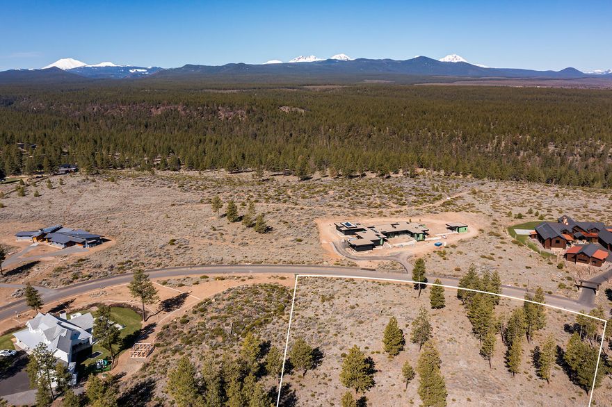 Welcome to Lot 36 in Westgate, the perfect canvas to build your architectural masterpiece where the ultimate Central Oregon lifestyle awaits with an unrivaled blend of nature and urban convenience featuring easy access to trails, parks, dining and activities. Highlighted by some of the best topography for privacy in all of Westgate, this spacious west facing lot is truly a hidden gem. Lightly wooded with a gentle slope and long range views. A unique opportunity with all adjacent homesites built-out, you know exactly what you are working with to design your home to frame the expansive 8-peak Cascade mountain view spanning from Mt Bachelor to Mt Jefferson. Experience the amazing setting and spectacular views by walking the lot. A large wooden stake with painted top marks the proposed building site to best capture views where your main level would sit approximately 10 feet above natural grade. With preliminary design plans and a premier builder lined up, you could break ground this year!