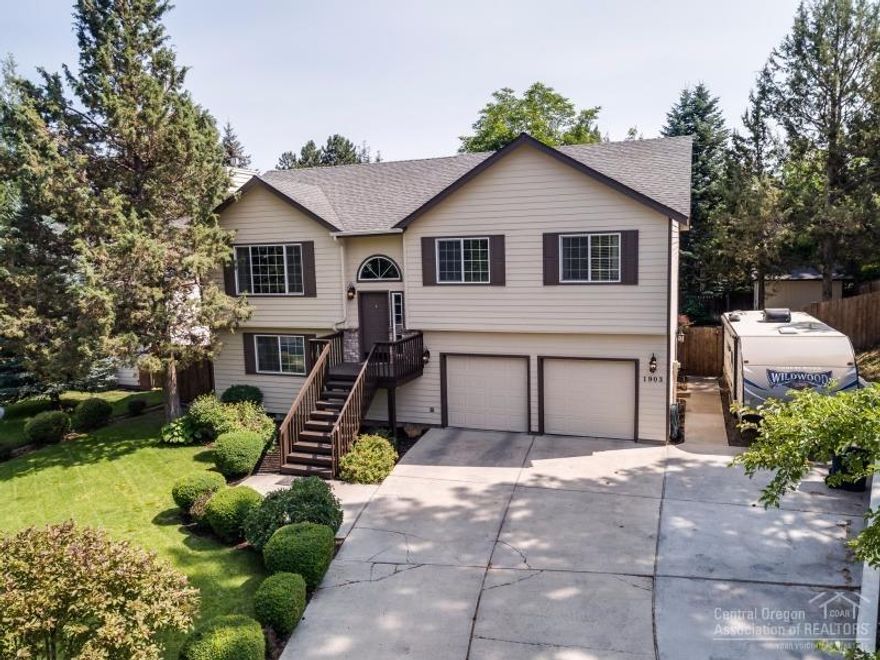 You will love the privacy of this well landscaped and wonderfully renovated 3 bed, 3 bath home on almost a 1/4 acre. Features include bonus room, office, fully fenced backyard, RV parking, oversized garage, floor to ceiling rock fireplace, kitchen w/SS appliances, granite tiled counters and hardwood floors. Downstairs could be great as a separate suite with bonus room, wet bar, laundry, full bath and bedroom.