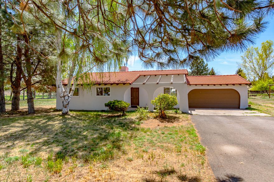 Bring your horse or 4-H project & enjoy living just minutes from downtown Redmond, in a country setting. Spanish style home w/clay tile roof, freshly painted & awaiting your personal touch inside. 3 bedrooms, 2 full baths & a great room style living space w/tile floors in the kitchen & dining. Stay cozy all winter w/a pellet stove in the great room. Outside you'll appreciate the flat lot w/plenty of space for your RV & toys, irrigated pasture for critters & dry lot too. Small barn for tack/hay storage or animal shelter. Private access to over 4 acres of community riding area exclusive to La Casa Mia homeowners. Low HOA dues of $340/year cover household water, dues, & irrigation system maintenance. Irrigation is pressurized from COID which makes it easy. Don't miss this one!