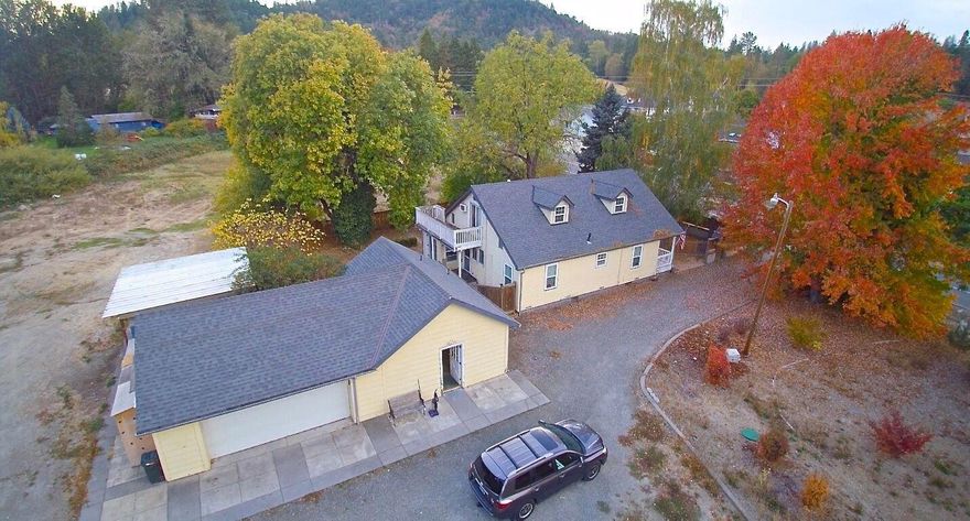 Possibilities here. Great, level 2+ acre farm style property has year round creek, shop, covered RV parking and District 7 schools. Home needs a bit of work. Has 2 bedrooms plus a huge loft. This is the complete package...close to town for a great price.