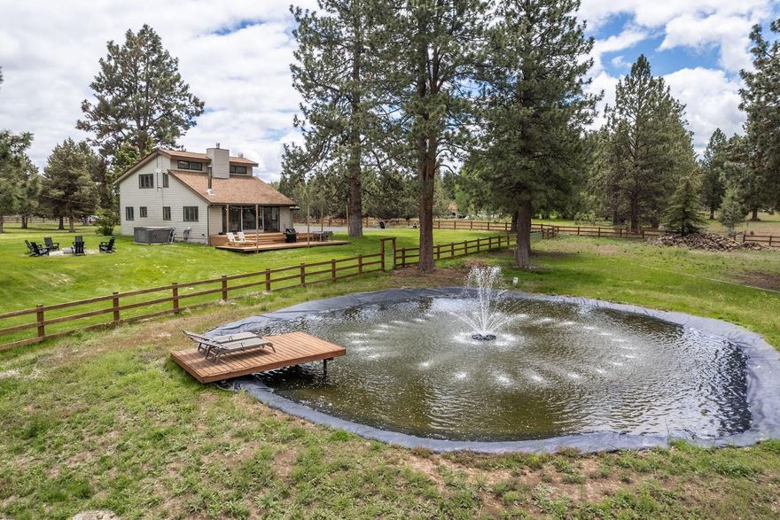 This fully fenced and gated green acres with towering pines can be accessed through two private roads, one of which is paved. Charming renovated home is nicely perched, taking in mountain views, water feature and pasture. Light and bright with high ceilings, hardwood floors and cozy certified wood stove. 4.78 acres with four acres of water rights. Newer barn is 46x60 with 20x60 finished and heated space.  Room for all the animals! RV parking, dump, water and 30 amps. Nicely landscaped with 5-zone sprinkler system. Hot tub and new fire pit. Seller has architectural plans drafted by Shelter for addition to the home.