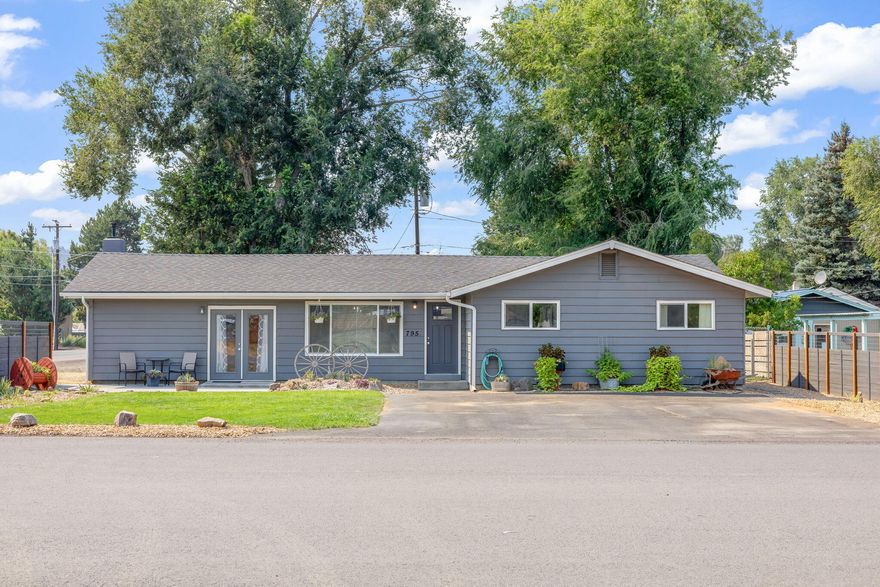 This fully updated 3-bedroom, 1-bath home sits on a spacious .24-acre corner lot & has everything you need! Inside, you'll find brand-new flooring throughout, fresh
paint & lighting. The kitchen is completely redone with solid surface counters, a huge island with architectural wood beam, updated appliances, its perfect for cooking,
hosting, or hanging out. Large bonus room with pellet stove is currently being used as a 4th bedroom/primary suite, could easily be used as a family room or game
room. The bathroom is fully updated with brand new tiled shower & double vanity. Outside, there's new fencing, gutters & fresh landscaping. The property is fenced,
with RV parking & hookups, super convenient if you've got a camper or guests visiting. There's also alley access to the backyard & a detached outbuilding that has
tons of possibilities to be turned into an ADU or workshop. This home is totally move-in ready & has space to make it your own. Come see all if has to offer!