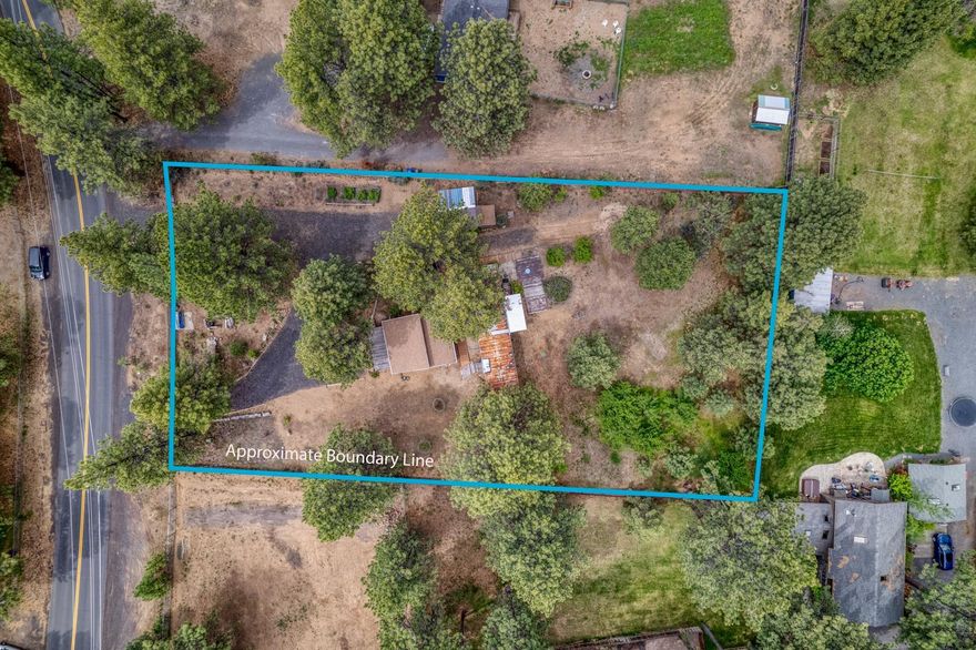 Fully fenced, level lot on paved road in Deschutes Riverwoods with 1976 single-wide manufactured home, 576 sq. ft. unfinished structure, and storage shed. There are a lot of possibilities! You can live in manufactured home while building, finish or expand the unfinished structure, or replace older manufactured home with new one. The manufactured home is clean and has a newer electric furnace. Property has a standard septic system that was replaced in 2011 with concrete tank and new leach lines. Property is on community water.