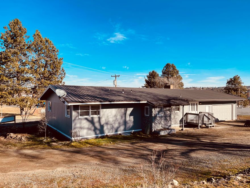 Back on the Market due to no fault of Seller. Huge Lot, 1.48 Acres, 3 bed 2 bath, Designer laminate floors, New Custom Kitchen, New SS Appliances, Updated Electrical, Updated Plumbing and New Plumbing Fixtures, New, State of the art Heating and Cooling system, New Bathrooms, New Doors and Hardware, Metal Roof, RV Parking and Hookups, Huge lot which could be developed into more homes or possibly Apartments (talk to City of Madras), or build a shop and have your own in-town Oasis. Existing concrete pad for storage or shop, Across the street from the Madras high school and a blocks away from Willow Creek trail.