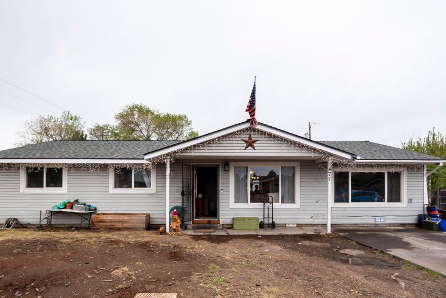 Here is a wonderful opportunity to own a single level 4 bedroom home in an amazing location! This home is on a large corner lot with alley access to the back yard, is right across from Redmond's new Baker Park and is only a few blocks from the dry canyon access and Kalama park. The home has been completely updated with new flooring, paint, solid surface kitchen counters, all new light fixtures and a roof with a transferred warranty with 48 years remaining. Home has ductless heat and A/C along with a gas fireplace in the master. Truly do not want to miss this great opportunity!