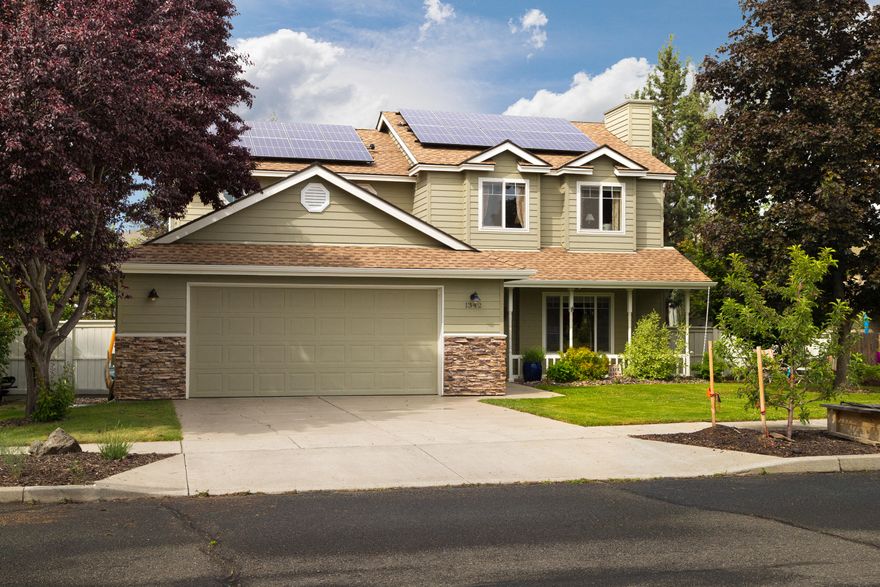 There are a ton of upgrades to this beautiful 2-story home in convenient NE Bend that is close to shopping and the hospital.  On the first floor you will find updated granite counter tops, new SS appliances in the kitchen, a half bath, dining room, living room, family room area and gorgeous cherry hardwood floors throughout.  Four bedrooms and 2 baths are upstairs; one of the bedrooms could easily be converted to office space if needed.  This home has quite a few green features including solar power, Level 2 electric car charger outlet, upgraded attic and crawl space insulation, low VOC paint in the interior and COREtec flooring the bathrooms.  Fenced backyard includes deck and hot tub and the front yard has irrigated garden boxes.  Newer roof, water heater and AC too! There is so much to love about this charming home!