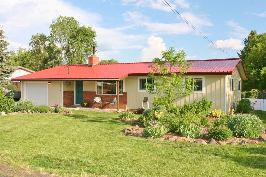 So very attractive & clean! Charming 3 bedroom in South Suburbs in move in condition. All located on a beautiful .28 acre lot with loads of RV parking, big covered wood shed, super deck for outdoor BBQ's, many mature trees, attractive landscaping with flower gardens, raised vegetable beds, healthy producing berry bushes & fruit trees, herb gardens & more. Boasting fresh interior & exterior paint, the bright & cheery kitchen includes all appliances, huge laundry room with bright sunny windows includes washer/dryer, new laminate flooring, newer metal roof & garage door, vinyl windows, F/A gas furnace new 2010. Walking distance to Ferguson Elementary school & the OCE trails. Super clean & attractive so hurry fast on this one.