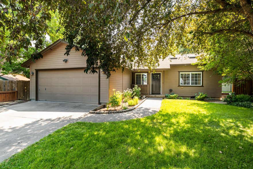 Nestled on a private lot in a quiet cul-de-sac, this single-level home offers a fully-fenced backyard with a rare benefit: its own private entrance to Al Moody Park. 16 acres of green space, complete with a fitness trail, basketball court, playground, covered picnic area, and even winter sledding, become an extension of your backyard. Inside, laminate wood flooring, vaulted ceilings, and skylights make the space feel open and bright. The stylish kitchen features stainless steel appliances, reclaimed floating shelves, and access to a back deck and patio perfect for outdoor dining. In addition to a covered front porch, enjoy a landscaped yard with front and back sprinklers, a greenhouse, raised garden beds, and a playhouse. Located in a vibrant neighborhood less than a 1/3 of a mile from 3 different parks (Al Moody, Stover, and Hollinshead), 5 minutes to St. Charles Hospital, Whole Foods, and Costco, and just 10 minutes to downtown Bend.