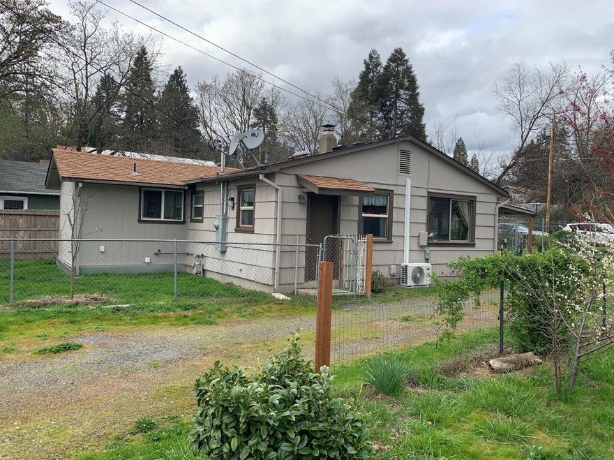 Looking for a starter home or downsizing this could be the one for your buyer. Cute & clean with heat pump,laundry room, upgraded electrical panel with whole house surge protector, newer extended front porch, and a detached one car garage. It is a two bedroom one bath, fenced yard for pets and located in nice NW neighborhood, within walking distance to most city conveniences. All info is deemed reliable but not verified, & subject to change.