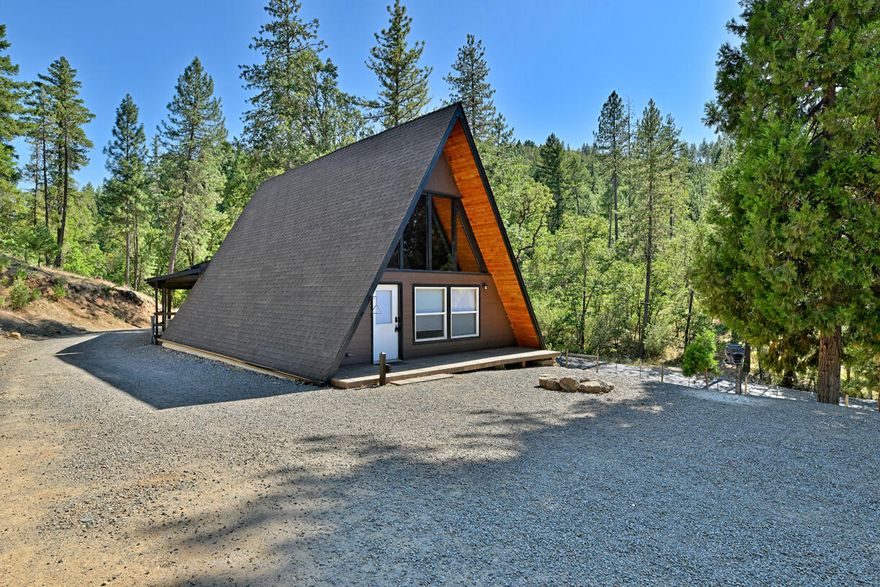 This charming A-frame home offers the perfect blend of cozy living and expansive outdoor space. Set on 7 beautifully terraced acres, this 2-bedroom, 1.5-bath property is ideal for those seeking peace, privacy, and room to roam—just a short drive from town.
Inside, you'll find warm, rustic charm with modern updates, plus a versatile office space featuring a loft area and private balcony—perfect for remote work, hobbies, or guest space. Outside, the property truly shines: a classic barn with upper-level storage, a deluxe ''chicken mansion'' for fresh eggs year-round, and lush grounds ready for gardening, animals, or just enjoying the view.
Need space for your toys? No problem—RV hookups are in place, with plenty of room for RVs, boats, and equipment. The sloped, terraced land offers stunning vistas and endless potential for homesteading, hobby farming, or simply enjoying Southern Oregon's natural beauty.
Come experience the magic of Sams Valley!
