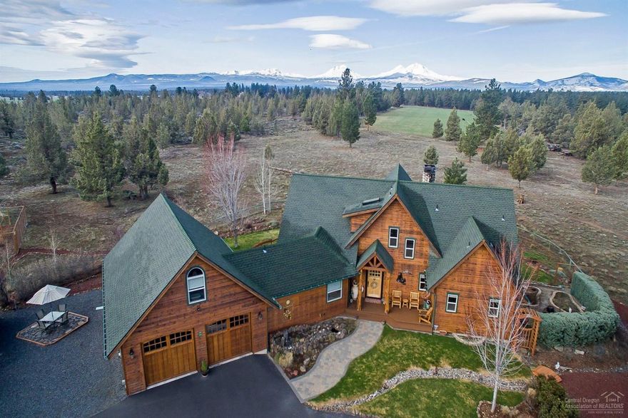 This piece of heaven is called Alpenglow, celebrating the rising sun's sherbet color on the Cascade Mountains. Built by Sunlight Construction, this 2,587 sq. ft. Pacific Northwest lodge-style home on 19.85 acres includes 3 bedrooms, 2 full baths, 2 half baths, a loft & bonus room. Enter into the vaulted great room anchored by the wood burning river rock fireplace. Floor to ceiling windows capture the sweeping mountain views, visible from every living space. The cook's kitchen includes granite tile countertops a propane range & large center island with breakfast bar and dining area. Main level master boasts mountain views, propane fireplace, hot tub access, Jacuzzi tub, plus a walk-in shower. Upstairs, two guest bedrooms feature views and window seats. Double-car garage leads to the insulated workshop & upstairs game room. 3-bay 40' x 30' shop has parking for your RV, boat, and more. Enjoy your orchard & vegetable gardens as the sun rises and sets over the Cascade Mountains, Alpenglow!