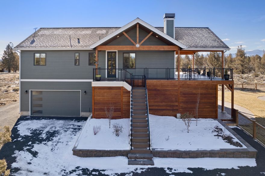 Be prepared to fall in love with these unobscured Cascade Mountain views!  Arrive down a picturesque tree lined driveway, enter the generously appointed home that features 3 bedrooms/3 baths/ 2112 sq ft in the main home resting on a 9.77-acre parcel.  Designed for entertaining, enjoy a great room with woodburning stove, gourmet kitchen, stainless steel appliances, quartz island connecting to the dining area which opens to a covered Lanai capturing amazing views overlooking a backyard paradise,  complete with an outdoor firepit to enjoy quiet evenings soaking in those views. Primary bedroom is on the main level, spacious bath w/ freestanding bathtub and an additional bedroom and bath. Downstairs is a family room and 3rd bedroom with an ensuite bathroom. Opens to the massive backyard Oasis with a beautifully manicured lawn.  In addition, you will find a darling 1 bedroom- 1 bath, detached 648 sq ft guest home complete with 1,000+ sq ft shop/workout room, chicken coup area with chickens!