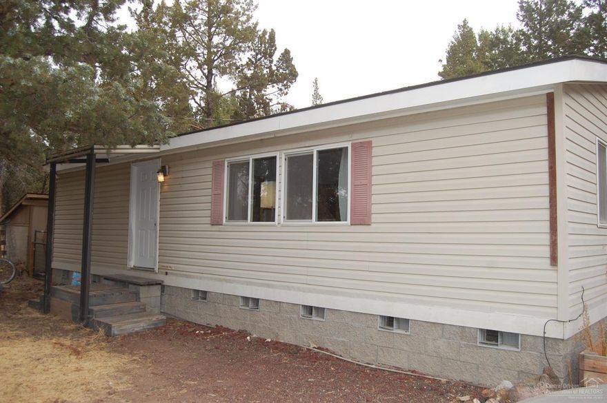 This cozy home sits directly across the street from Smith Rock State Park. Great room concept with open kitchen and vaulted ceilings. Large back yard is private and treed. Bedrooms are separated with their own baths. 7'X7' storage building, 10'X 12' metal shed & 6'Xv6' pump house. Furnishings are negotiable. This home has great potential as a vacation rental.