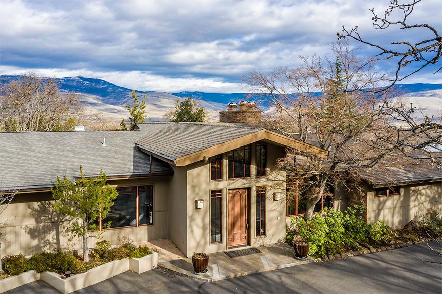 Rare offering! Truly beautiful property w/rare in-town Ashland setting on 4 irrigated acres. Gated entry leads to stunning 5551 SF mid-century view home including 1 bedroom & 1 bath apartment with separate entrance. Fabulous entry w/vaulted ceiling leads to incredibly attractive great room w/wide-plank Cherry floors, walls of windows w/prominent mountain views, stacked stone wood-burning fireplace & hearth & dreamy chefs kitchen w/6-person dining bar. The open kitchen is heart of the home & features uniquely beautiful rainforest marble counters, Thermador range, SubZero & walk-in pantry. Informal & gracious formal dining. Office areas & library w/fireplace. 5 bedrooms & 5 baths. This home has wonderful space & the grounds are glorious. Large lawn areas, flowering plants, mature trees, fruit orchard, stone walkways & walls, inground pool & Koi pond & cascading water feature framed by forever views. 3-car garage. City services. Development potential... SF to be verified by buyer.