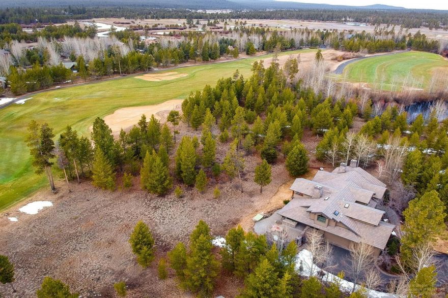 Spectacular golf and mountain views, expansive meadows, and meandering rivers await at this premier Crosswater residence. Nestled on an expansive and private corner lot among mature ponderosa and aspen trees, this Norman Building and Design estate is the pinnacle of luxury with quality craftsmanship, stunning architectural design elements and an open floor plan set against the backdrop of magnificent golf views. Offering 3770 square feet of well-designed living space, this home has 4-bedrooms including 3-suites, bonus room or 5th bedroom, 5-bathrooms, and an exquisite outdoor living space complete with kitchen and stone fireplace. The timeless design showcases the finest Pacific Northwest architectural style that celebrates the majestic setting of this private residence. This is the intersection of lifestyle and luxury!