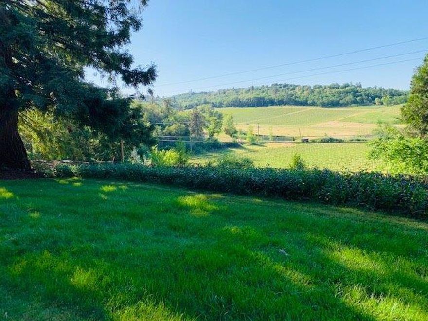 Amazing VIEW PROPERTY! This beautiful rural property is surrounded by acres of stunning views of the Rogue Valley, and the best wineries in our region. It sits in the heart of one of the most desirable and attractive areas in Jackson County. It is located on one tax lot and zoned for one homesite. It has FULL TID WATER RIGHTS-a major bonus! There is a septic tank and a 135 feet deep well. The property features a 1964 manufactured single wide home with an addition. It is fenced all around and backs up against TID property. There is a shop with electricity and cement floor. This picturesque property also includes fruit producing trees. It is a must see! Its a perfect spot for a new construction or a replacement manufactured home. Current home is outdated but livable. Home and property are sold AS IS.